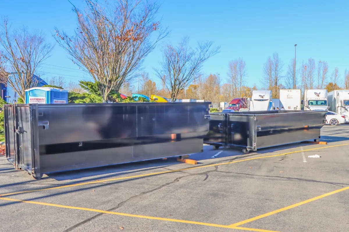 Professional dumpster rental service with roll-off container on residential driveway in Apache Junction